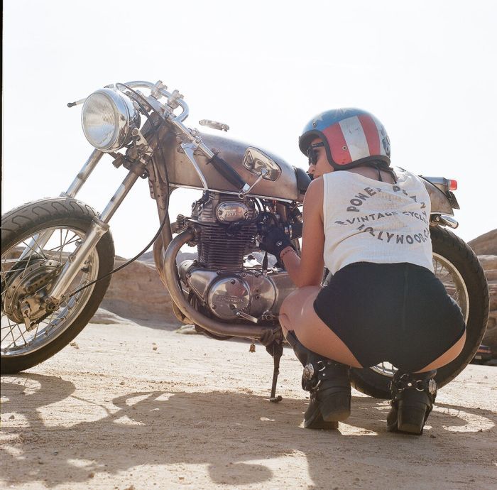 A playful frame from Girls on a motorcycle — online in Klang